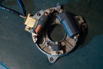 9.9 25 Hp Yamaha 6E7-85560-A0-00 Base Assy, Charge, Lighting, & Pulser 84-94. Fixed Price $225.00.