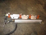 Suzuki DF90 90HP Outboard Fuel Rail And Injector Set (15750-90J00). Fixed Price $45.00.